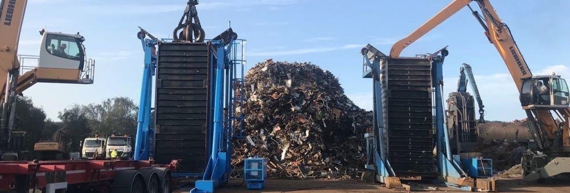 Two shipping containers being loaded with Ferrous and Non Ferrous metal