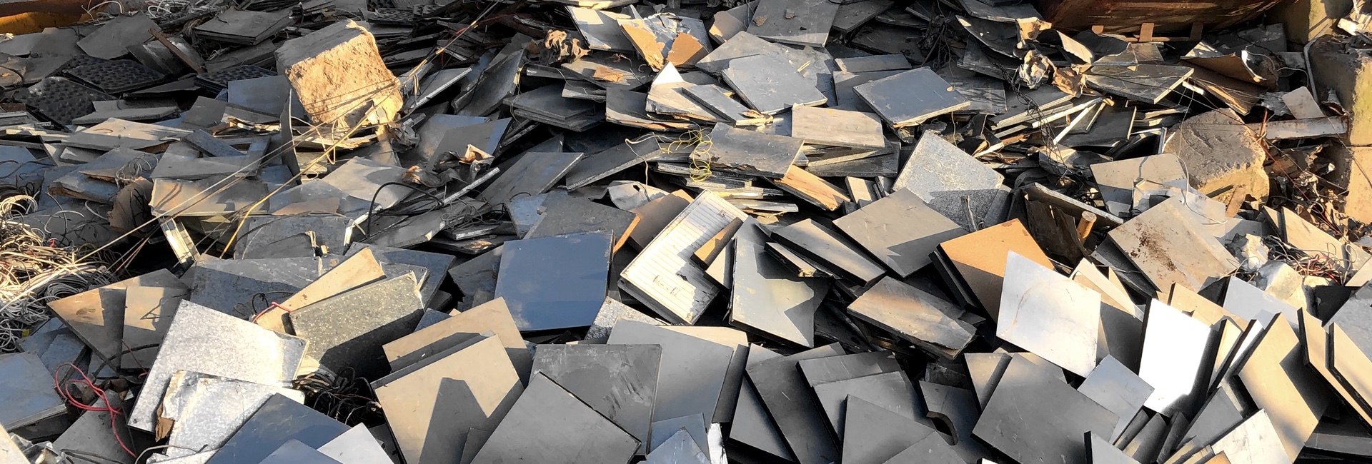 Scrap Raised Access Floor Tiles in a large pile.