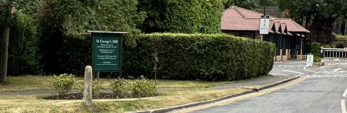 Green road sign reading 